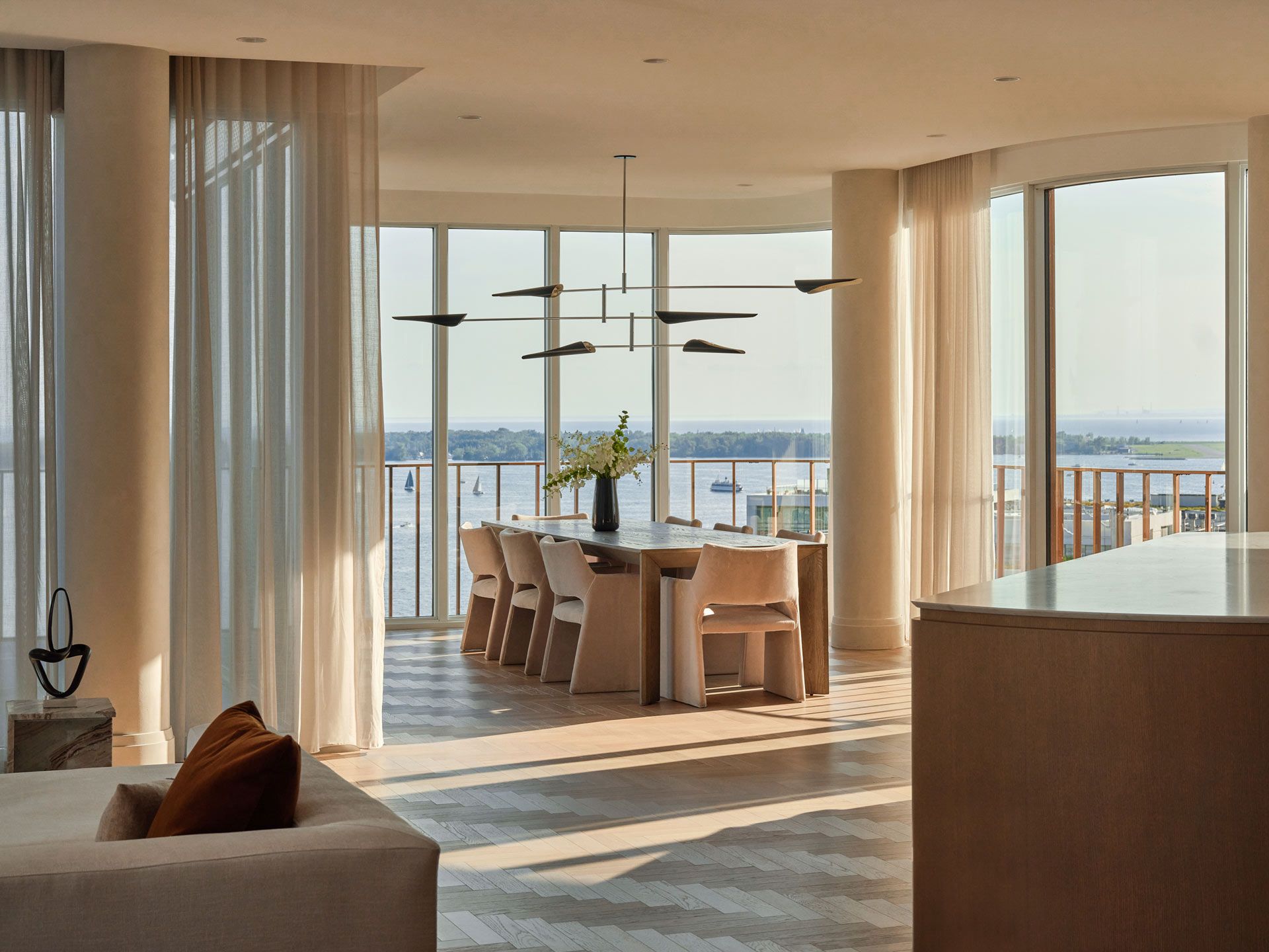 Dining room with floor to ceiling windows facing Lake Ontario
