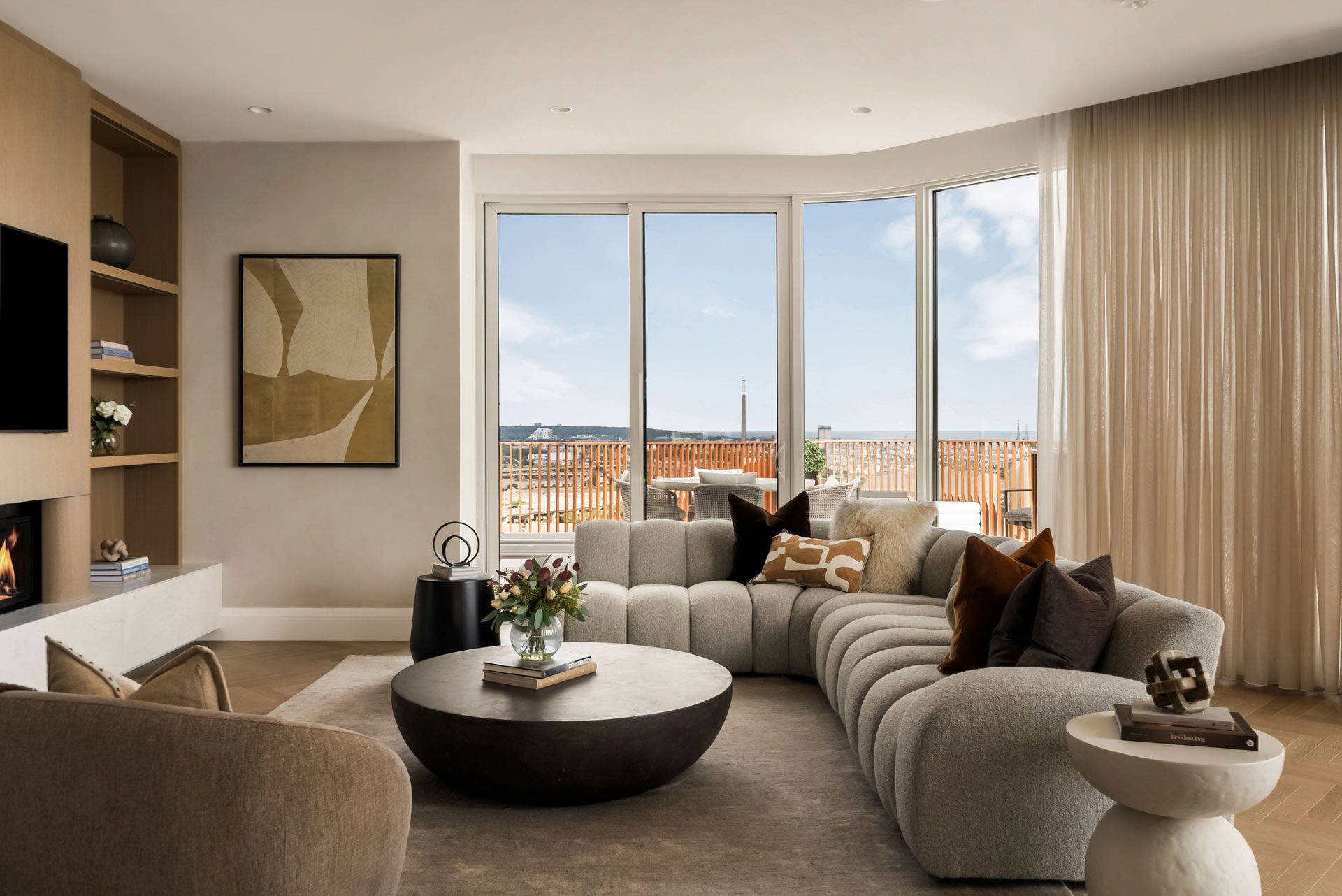 Living room with fireplace and lake view