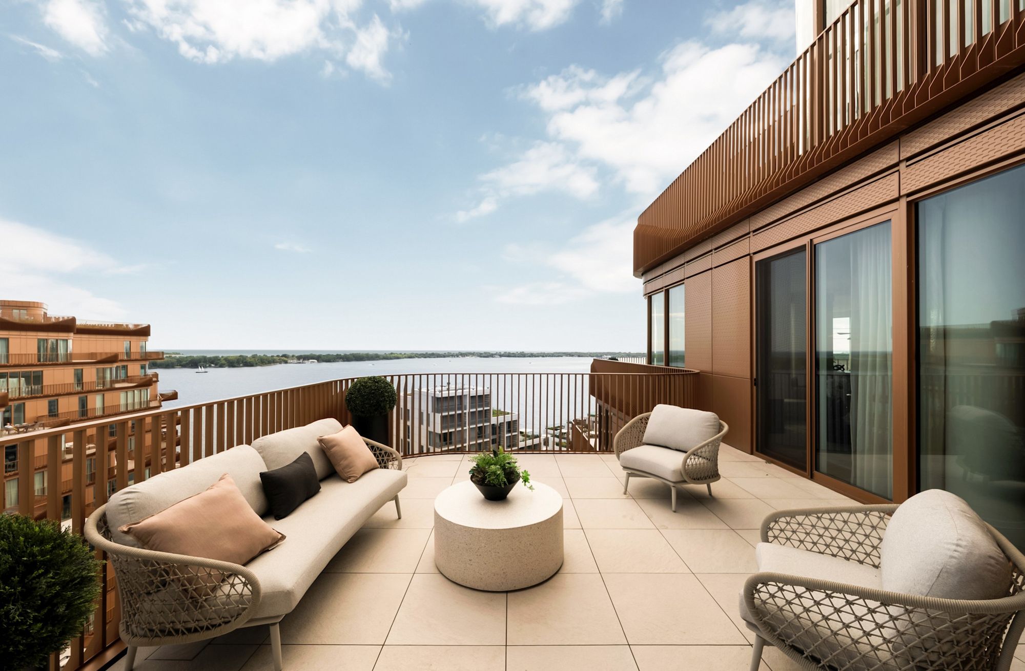 Terrace with lounge seating over Lake Ontario